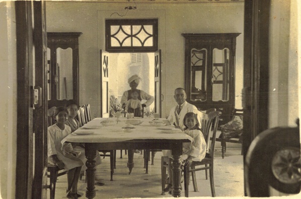 Tilly and Ghordhan (left), Jagadish (center), and Dharam Mukhi (front right) in dining room